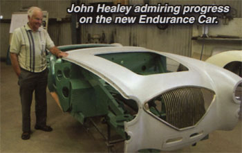 John Healey admiring the progress